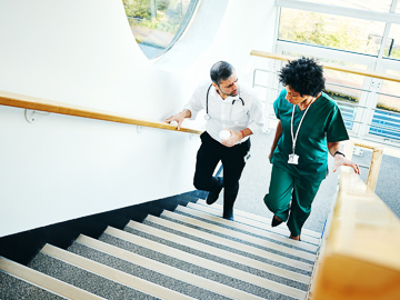 Medical professionals walking up the stairs