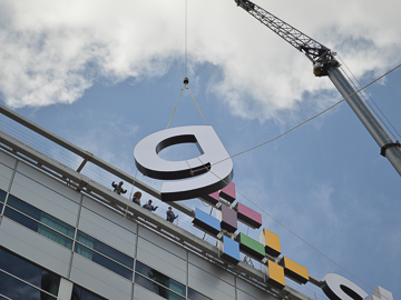 Crane hanging a sign